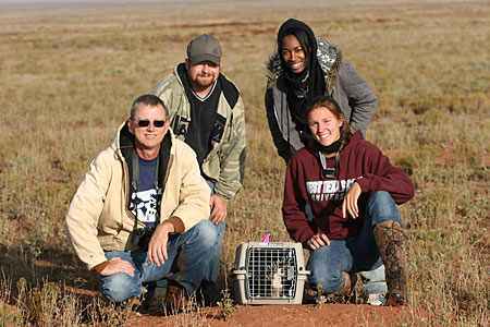 WTAMU Students posing with professor in a field